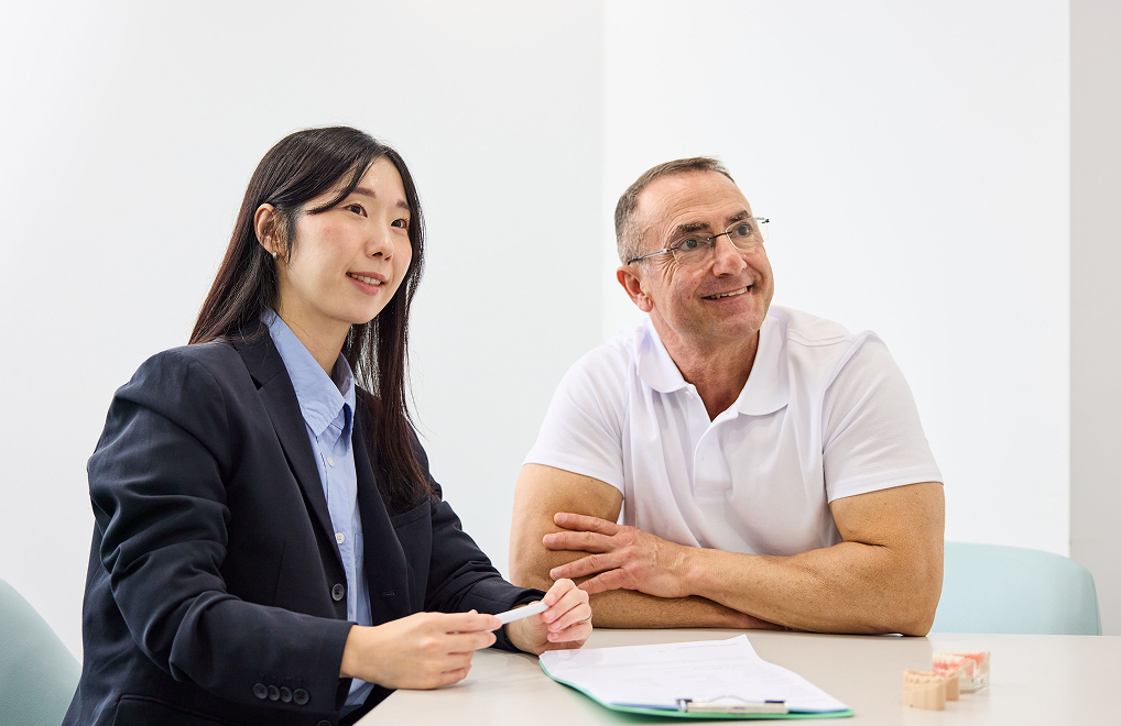 specialist talks to dental patient | australian dental specialists